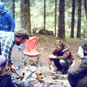 While camping, one spends a lot of time around the fire.  (Cross-processed Velvia 100 from a half-frame Fed Mikron)